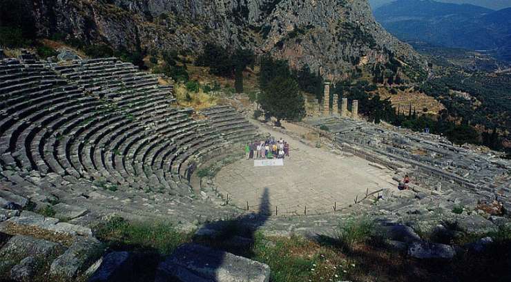 Theatre of Delphi with Apollo Temple in the background, Greece