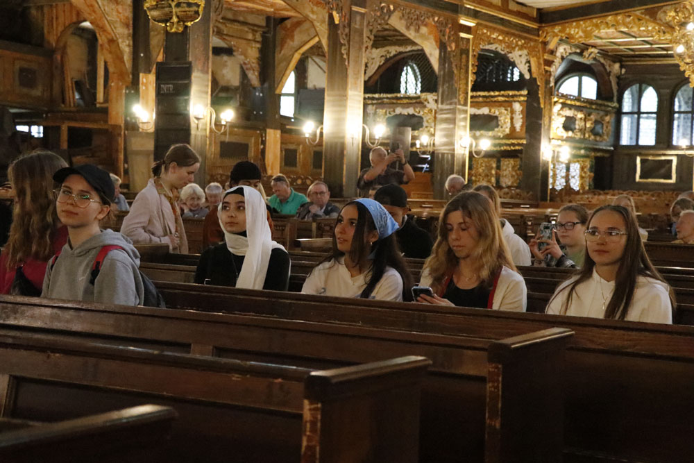 Church of Peace in Swidnica – students are listening to a guide